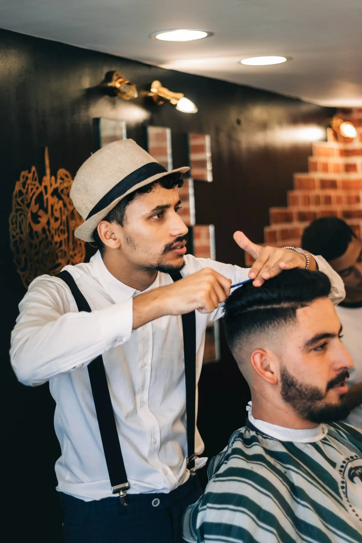Barber giving a client a fresh fade