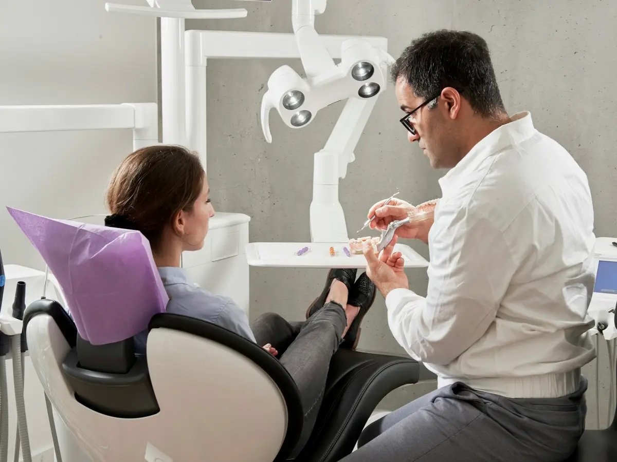 Dentist talking with a patient
