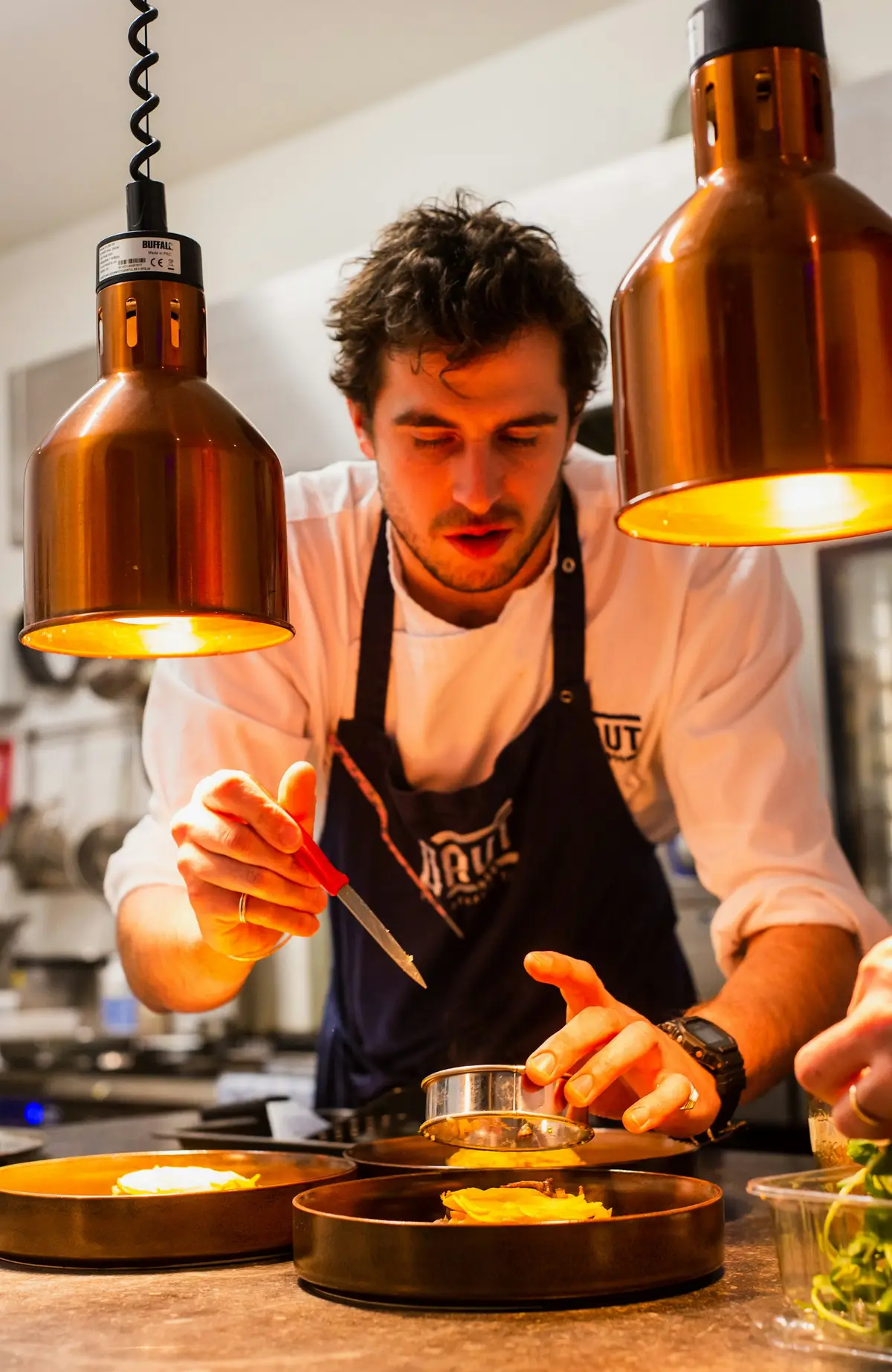 Our head chef plating a dish