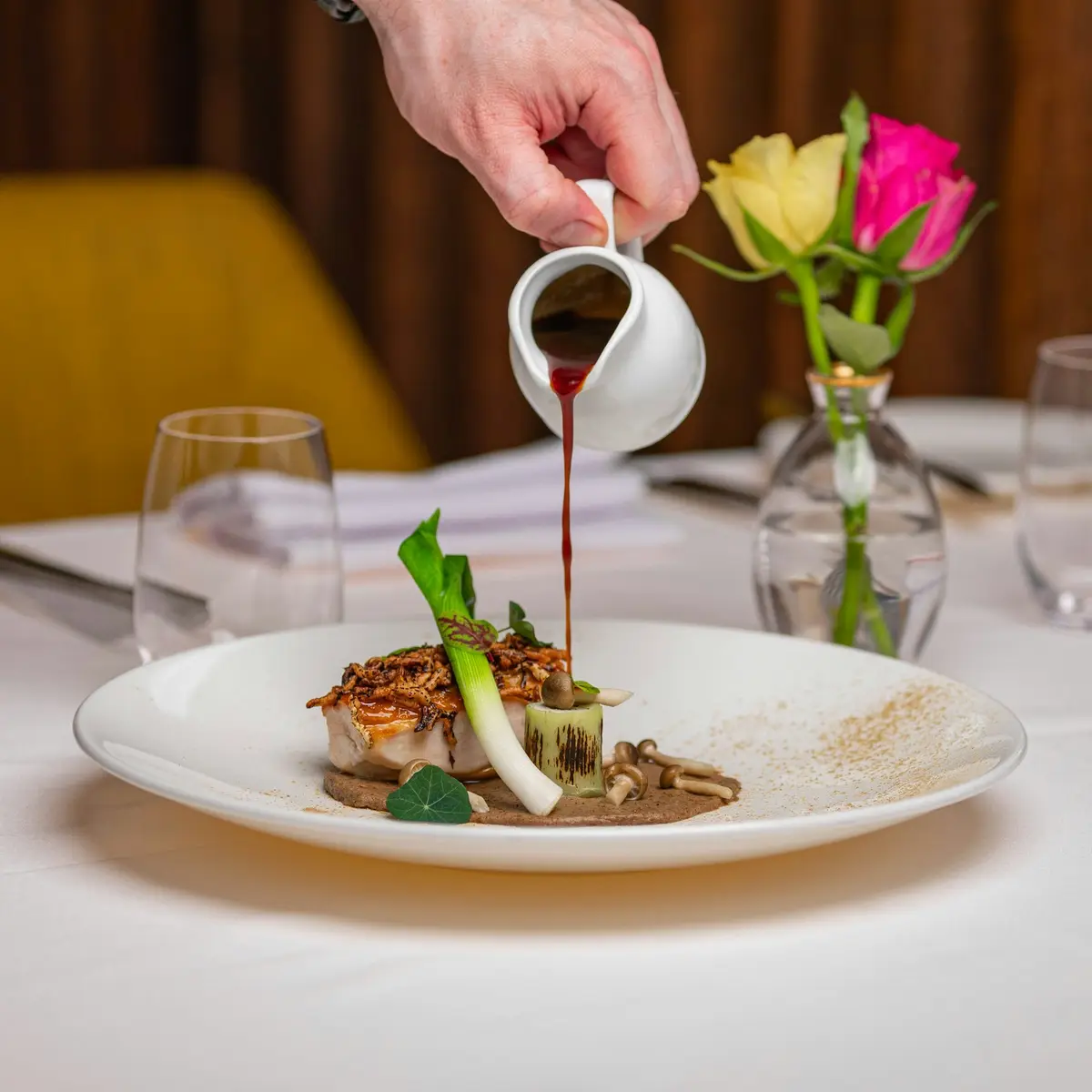 Sauce poured over a plated dish
